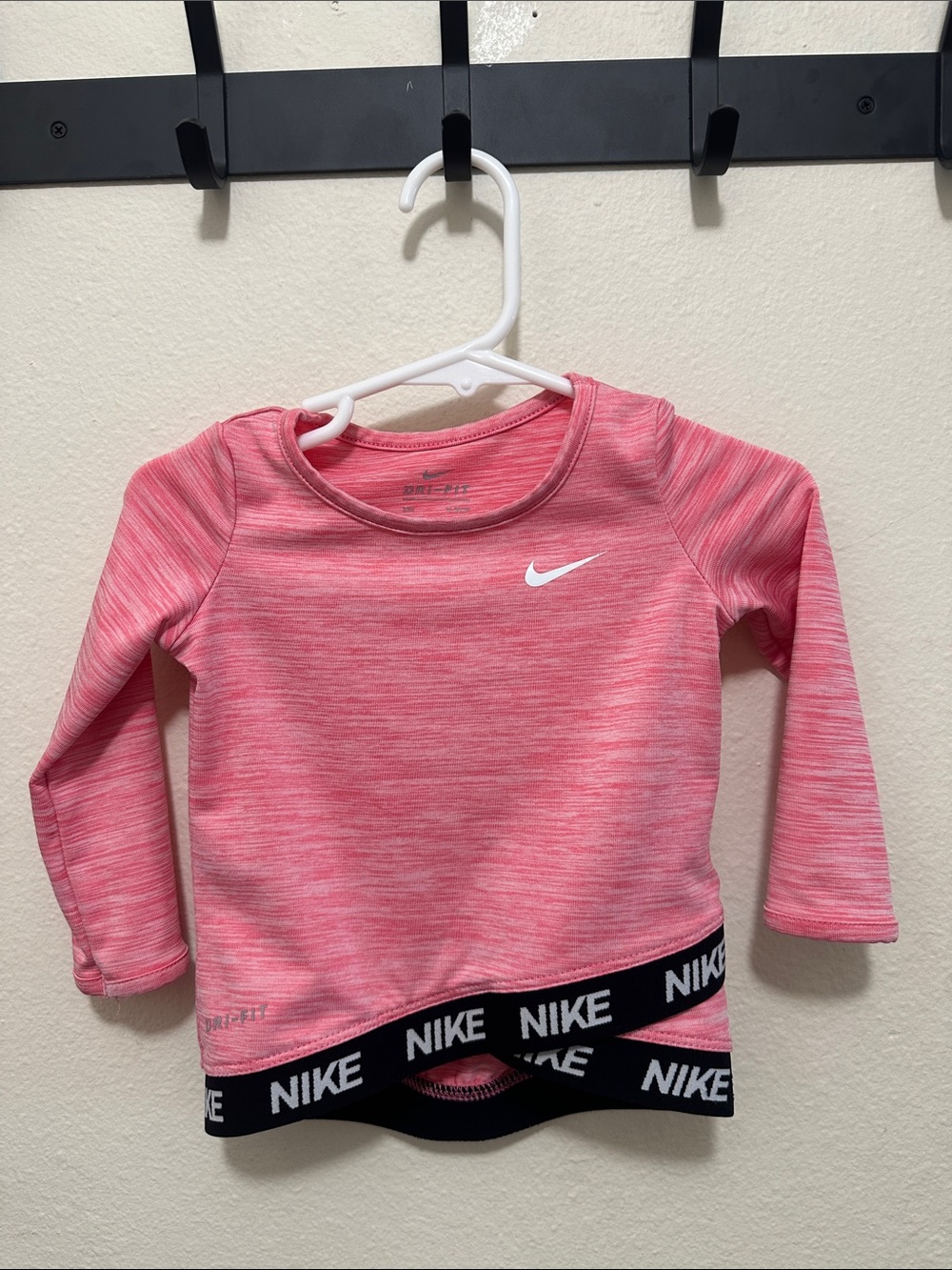 Nike Girls' Heather Pink Dri-FIT Long Sleeve Top with Black Logo Hem